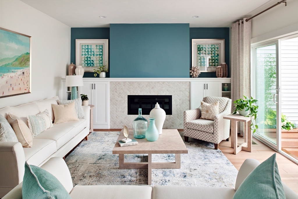 27 Firefly Point, Unit 27 Sudbury, MA 01776 - Photo 7 of 13 a living room with furniture fireplace and a large window