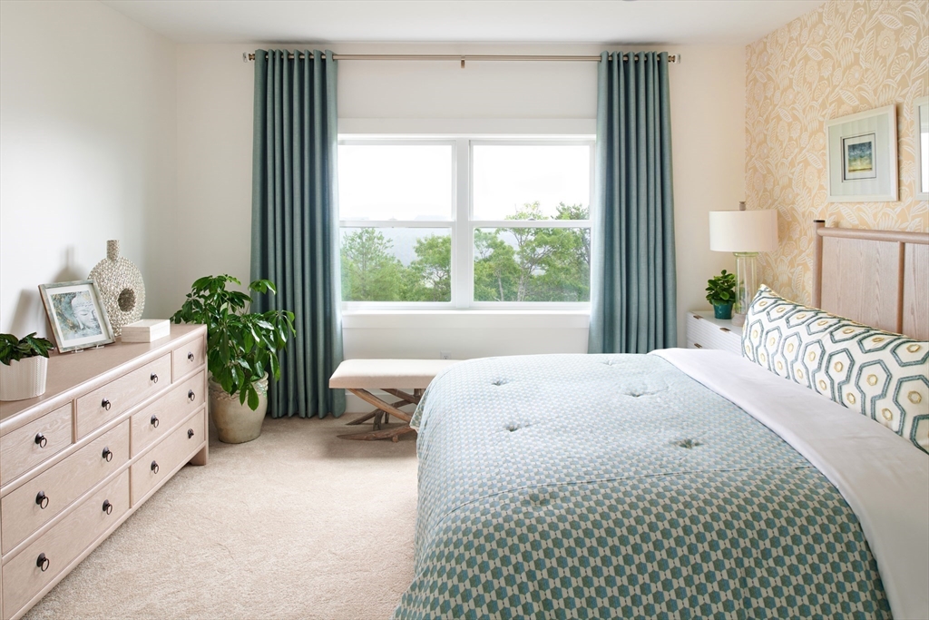 27 Firefly Point, Unit 27 Sudbury, MA 01776 - Photo 10 of 13 a bedroom with a bed and a window