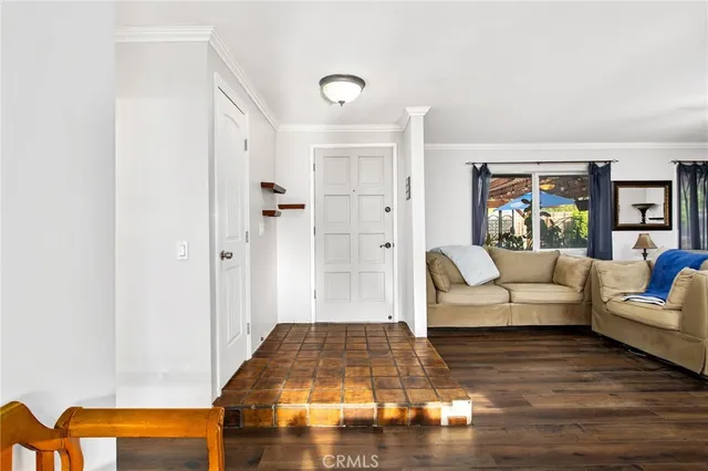 a living room with furniture and a rug
