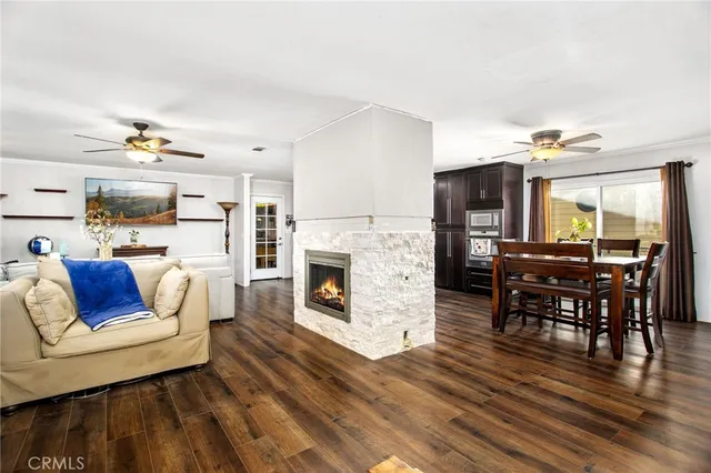 a living room with furniture and fireplace