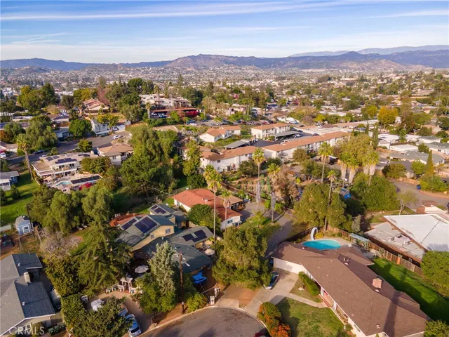 an aerial view of residential houses with outdoor space