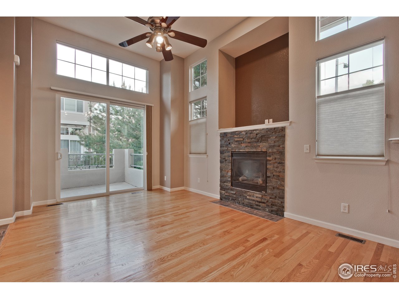 4112 Riley Drive Longmont, CO 80503 - Photo 6 of 28 Living Room w/ Awesome Fireplace & Patio