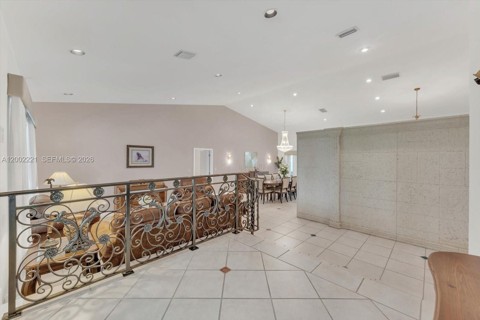9941 Southwest 143rd Street Miami, FL 33176 - Photo 5 of 48 Elegant foyer entry with a custom design wrought iron failing