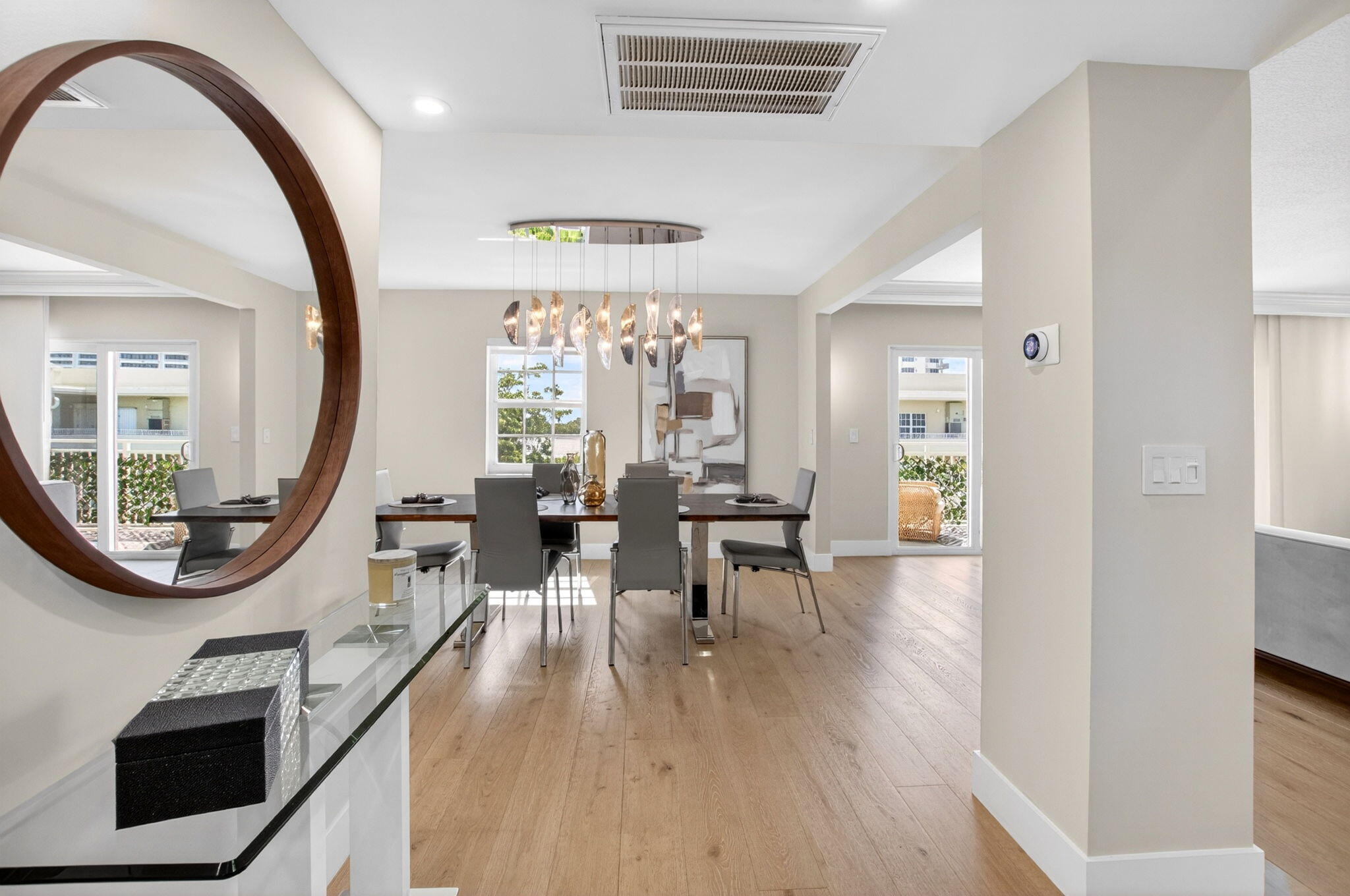 950 De Soto Road, Unit 5A Boca Raton, FL 33432 - Photo 5 of 98 a view of a livingroom with furniture and a mirror