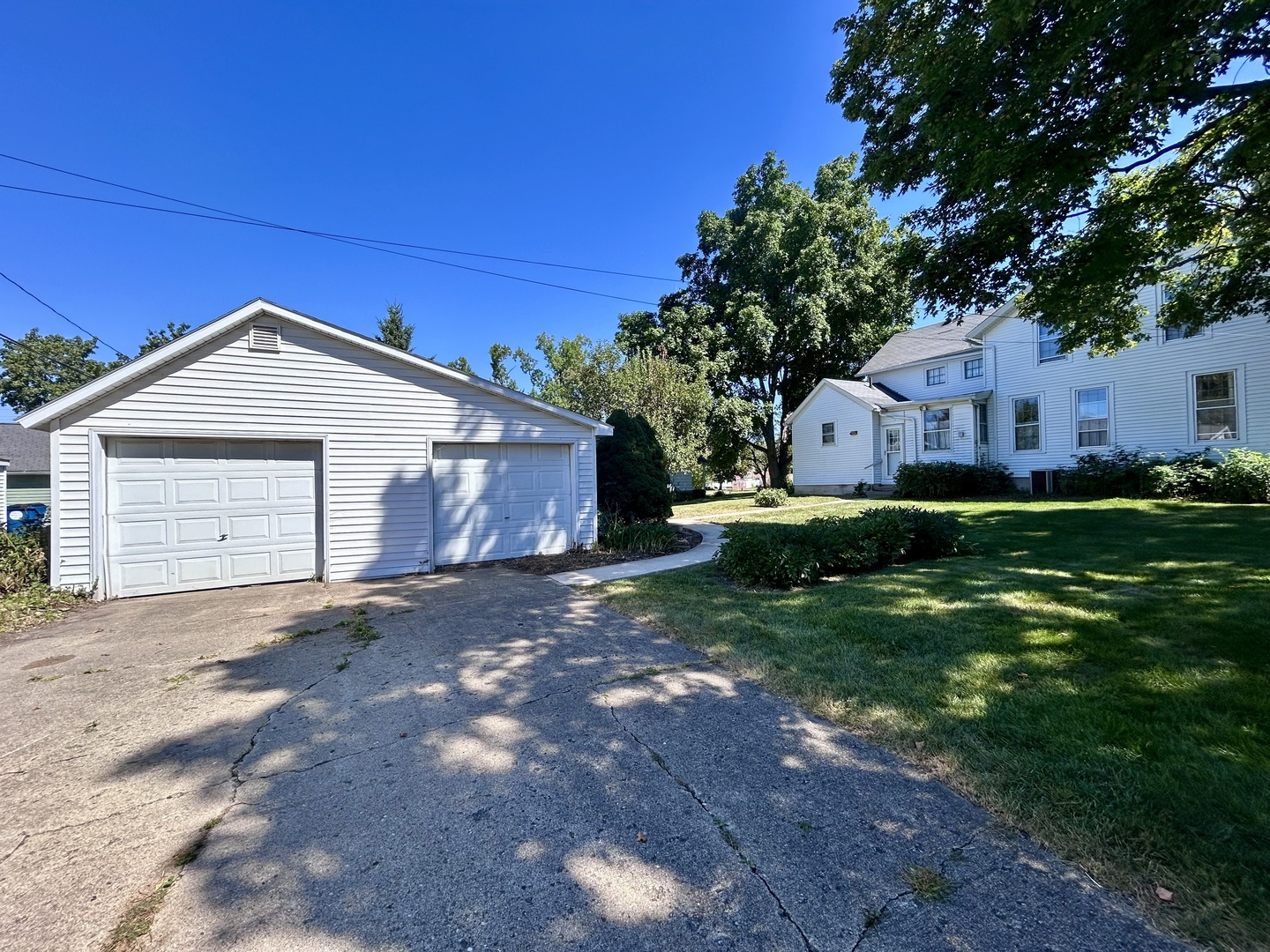 20 South Church Street Princeton, IL 61356 - Photo 17 of 17 a front view of a house with a yard and garage