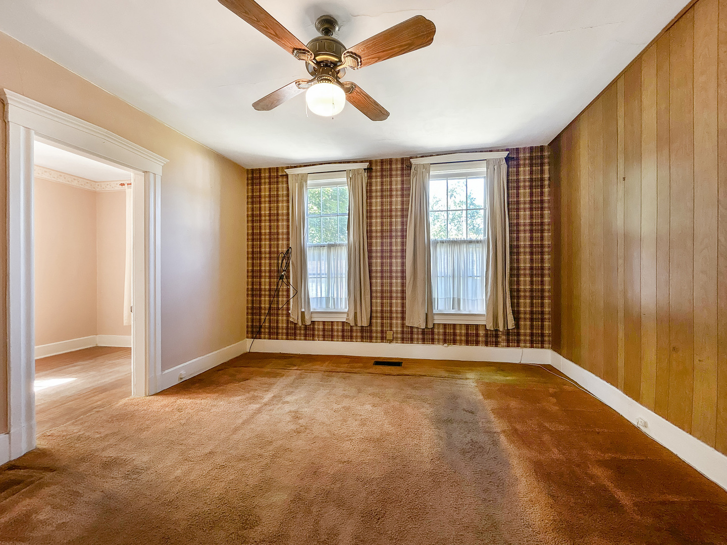 20 South Church Street Princeton, IL 61356 - Photo 6 of 17 an empty room with windows and fan