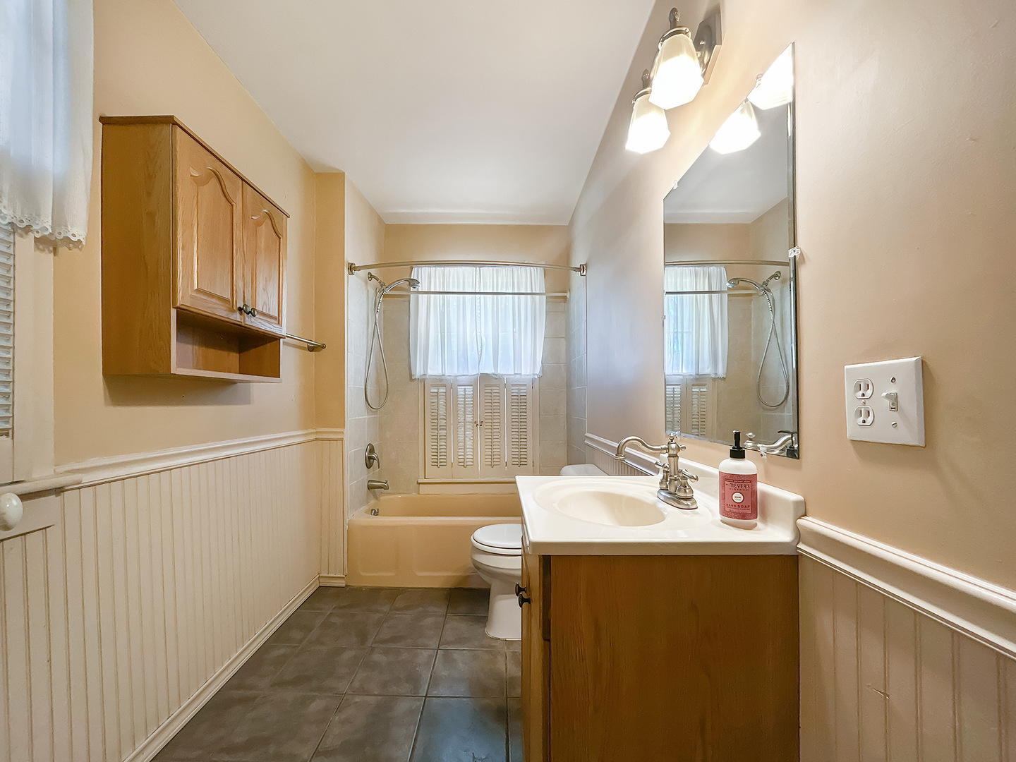 20 South Church Street Princeton, IL 61356 - Photo 7 of 17 a bathroom with a sink a toilet and tub