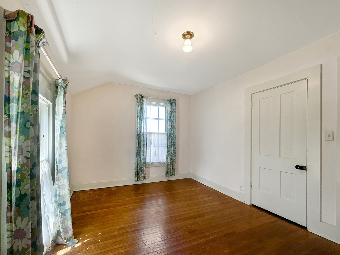 20 South Church Street Princeton, IL 61356 - Photo 9 of 17 a view of empty room with wooden floor and fan