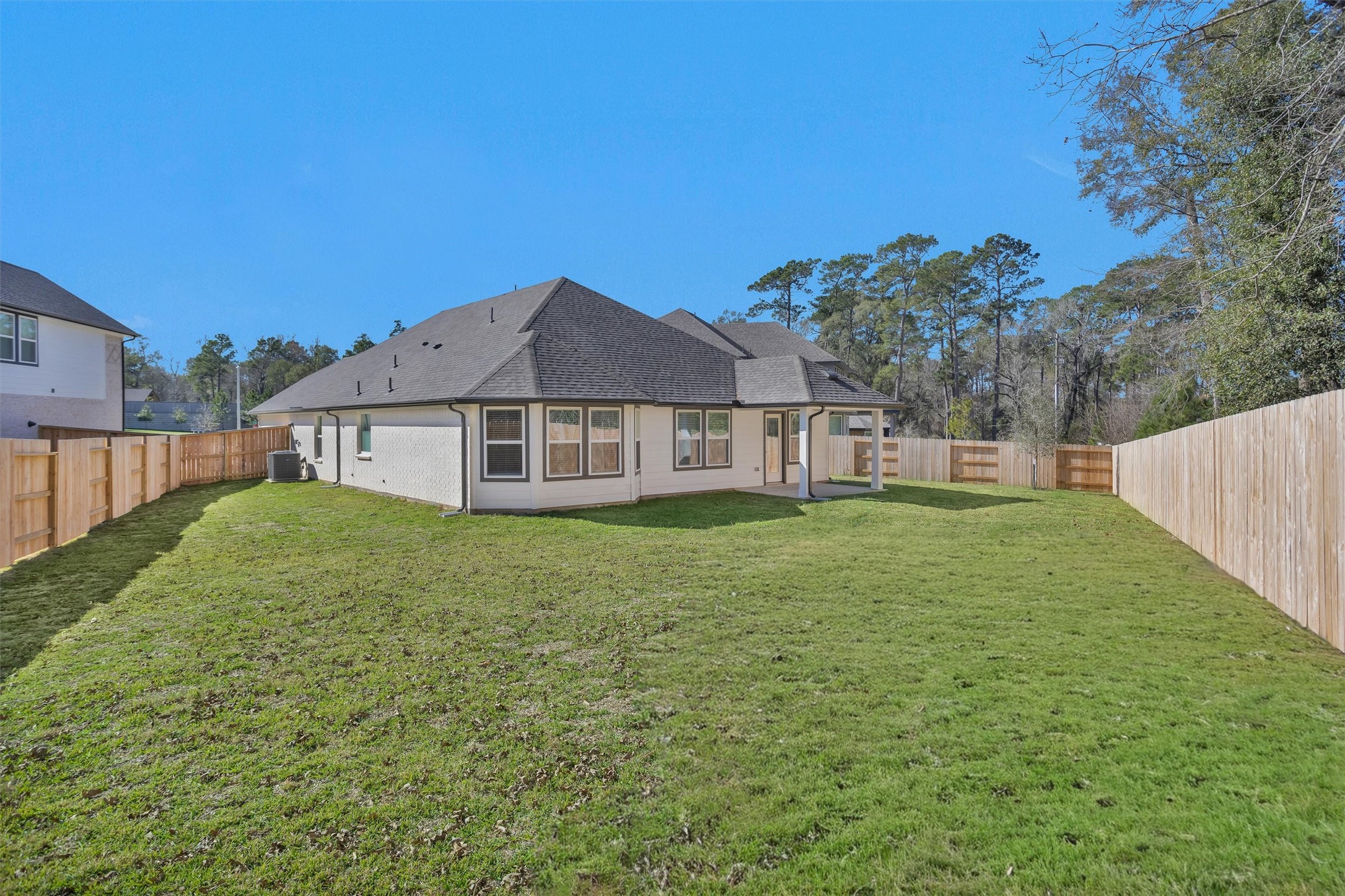 2002 Bluff Oak Street Conroe, TX 77304 - Photo 30 of 30 a house view with a garden space
