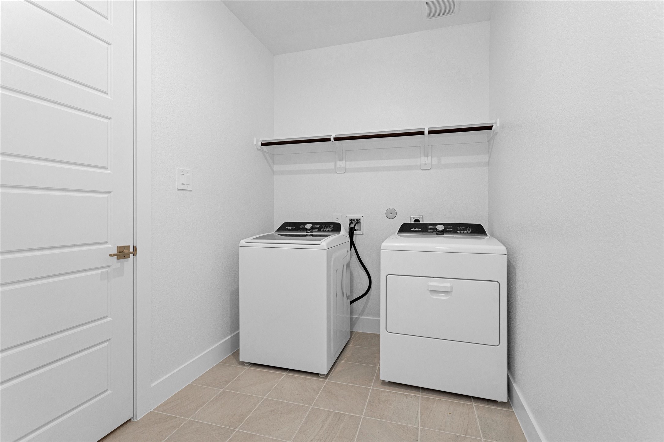 2002 Bluff Oak Street Conroe, TX 77304 - Photo 9 of 30 a utility room with dryer and washer