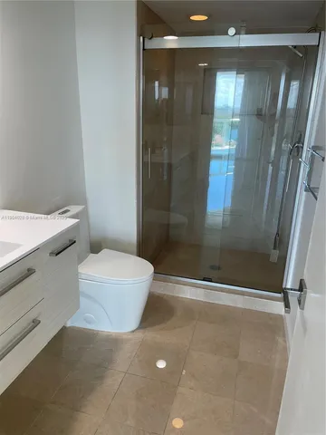 a bathroom with a double vanity sink and mirror