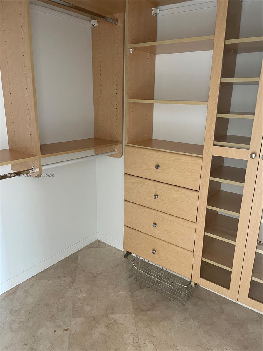 16500 Collins Avenue, Unit 1455 Sunny Isles Beach, FL 33160 - Photo 25 of 35 a view of an empty walk in closet