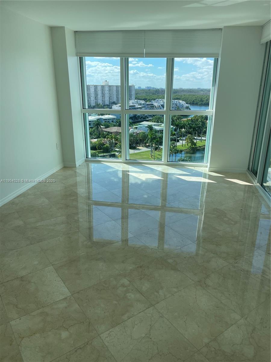 16500 Collins Avenue, Unit 1455 Sunny Isles Beach, FL 33160 - Photo 27 of 35 a view of an empty room with a window