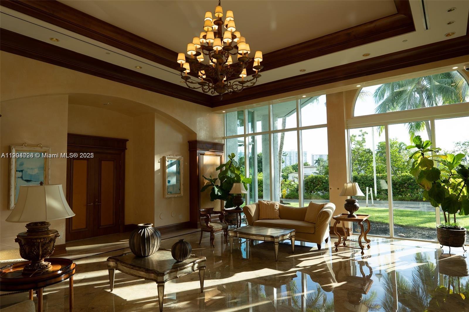 16500 Collins Avenue, Unit 1455 Sunny Isles Beach, FL 33160 - Photo 3 of 35 a living room with patio furniture and a large window