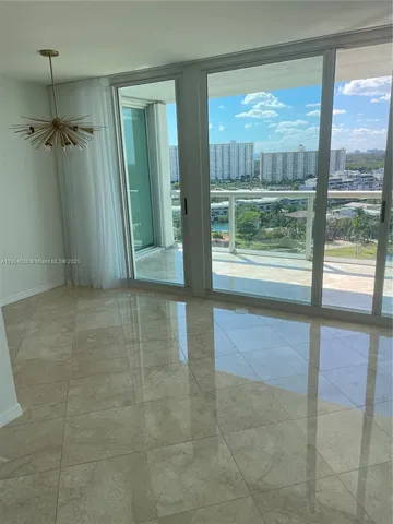 a kitchen with granite countertop a sink and cabinets