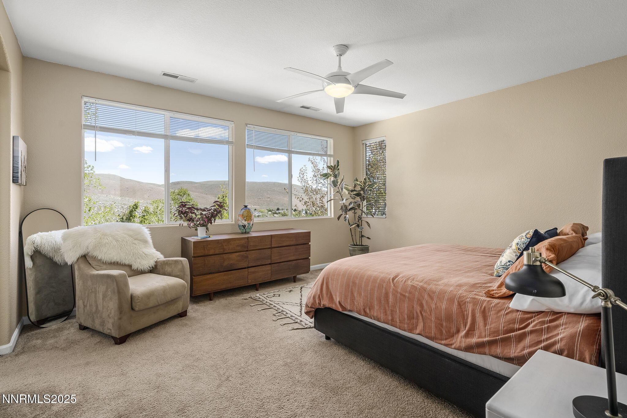 5765 Tappan Drive Reno, NV 89523 - Photo 14 of 27 a bedroom with a bed and a chandelier