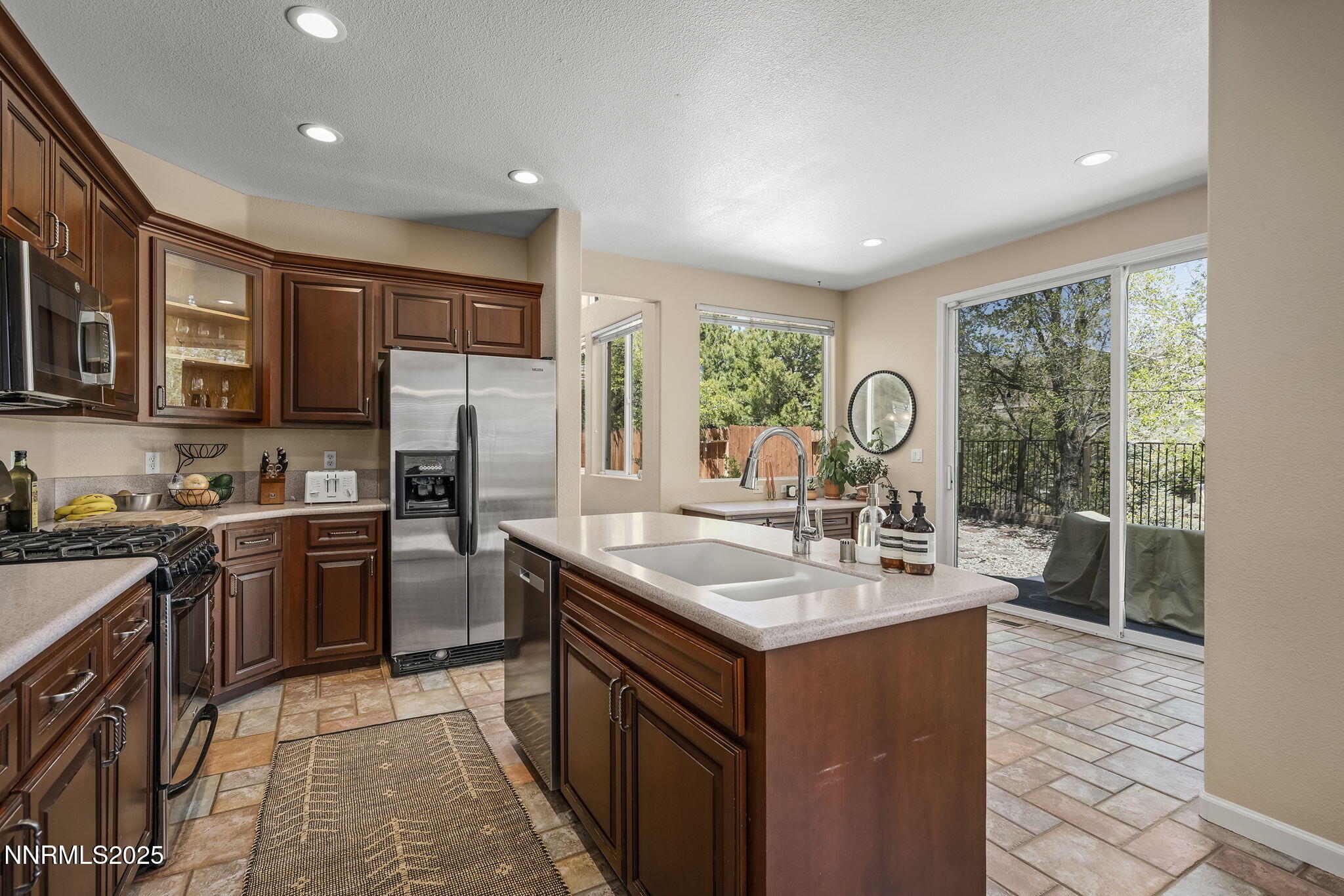 5765 Tappan Drive Reno, NV 89523 - Photo 9 of 27 a kitchen with a sink stove and refrigerator