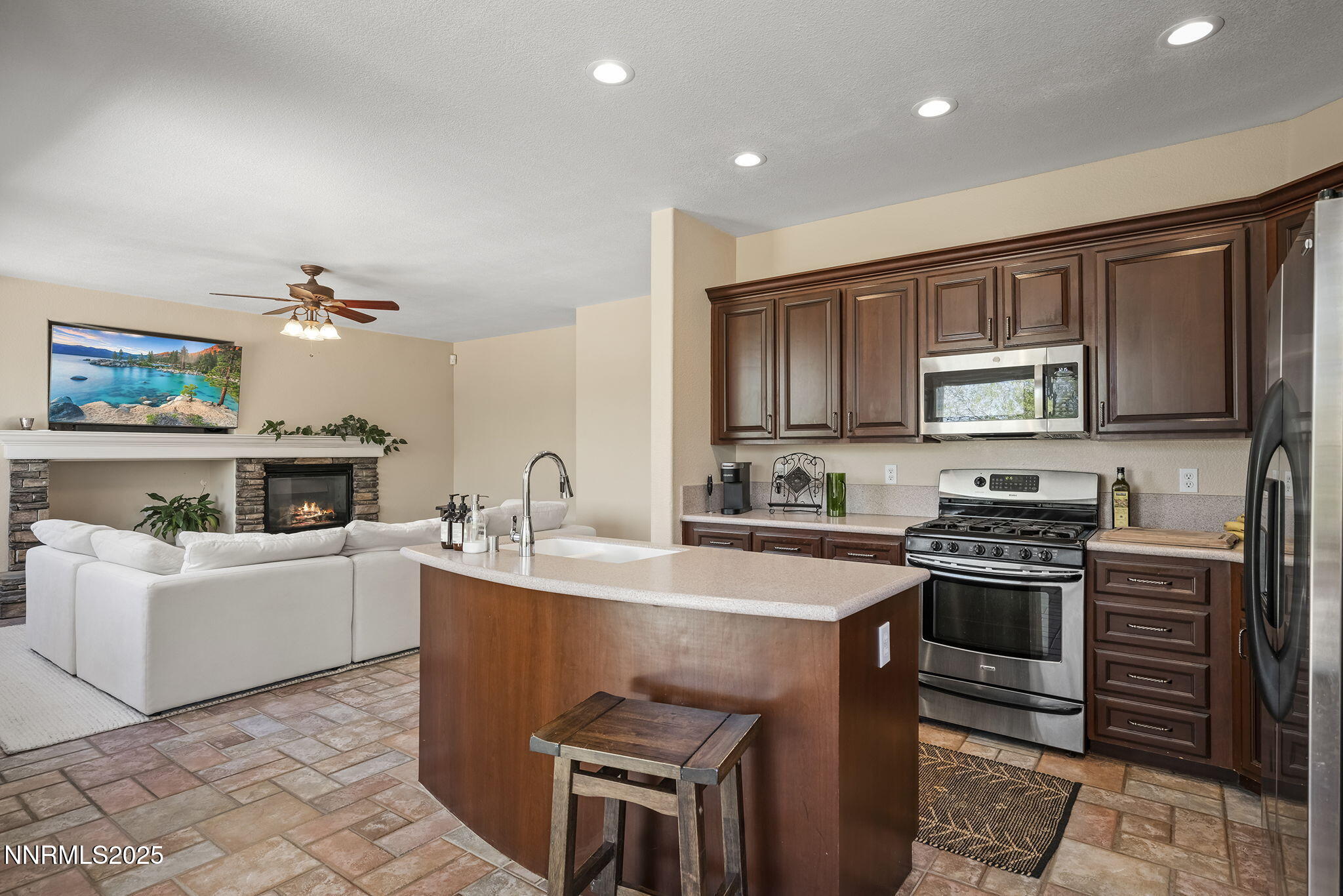 5765 Tappan Drive Reno, NV 89523 - Photo 10 of 27 a kitchen with a sink stove and microwave