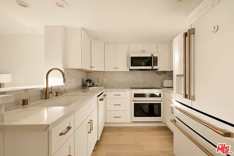a view of a hallway with washer and dryer
