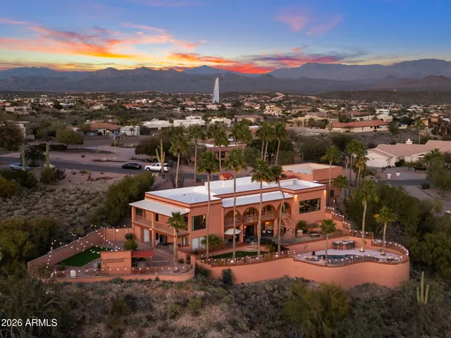 a view of a swimming pool with outdoor seating and plants