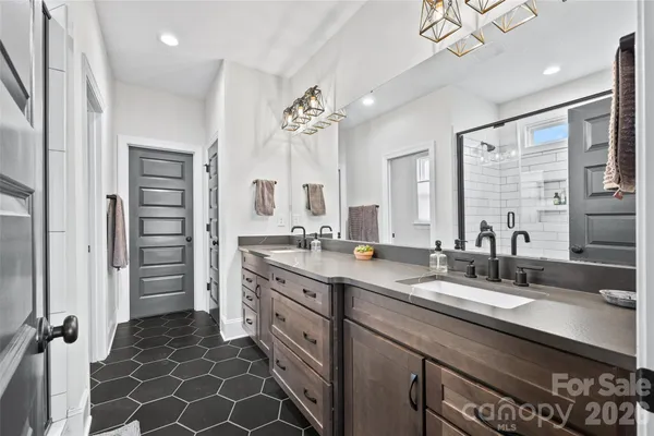 a bathroom with a double vanity sink double vanity and a mirror