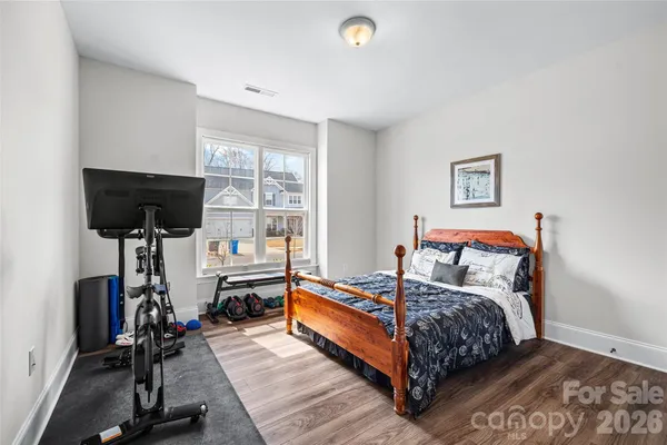 a bed room with a bed and a window