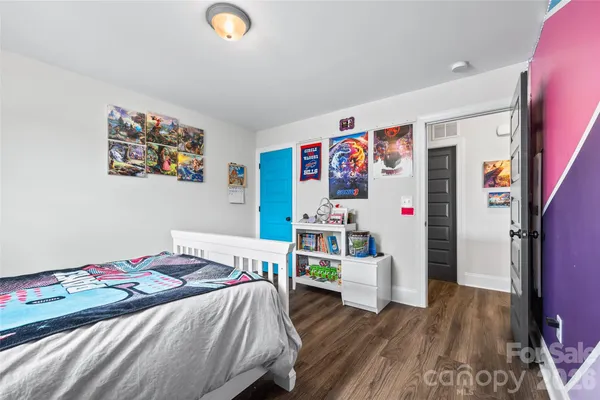 a bedroom with bed and a window