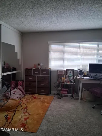 a workspace with furniture and window