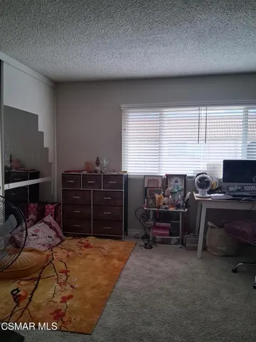 a workspace with furniture and window