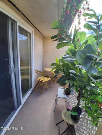 a bench sitting in backside of a house