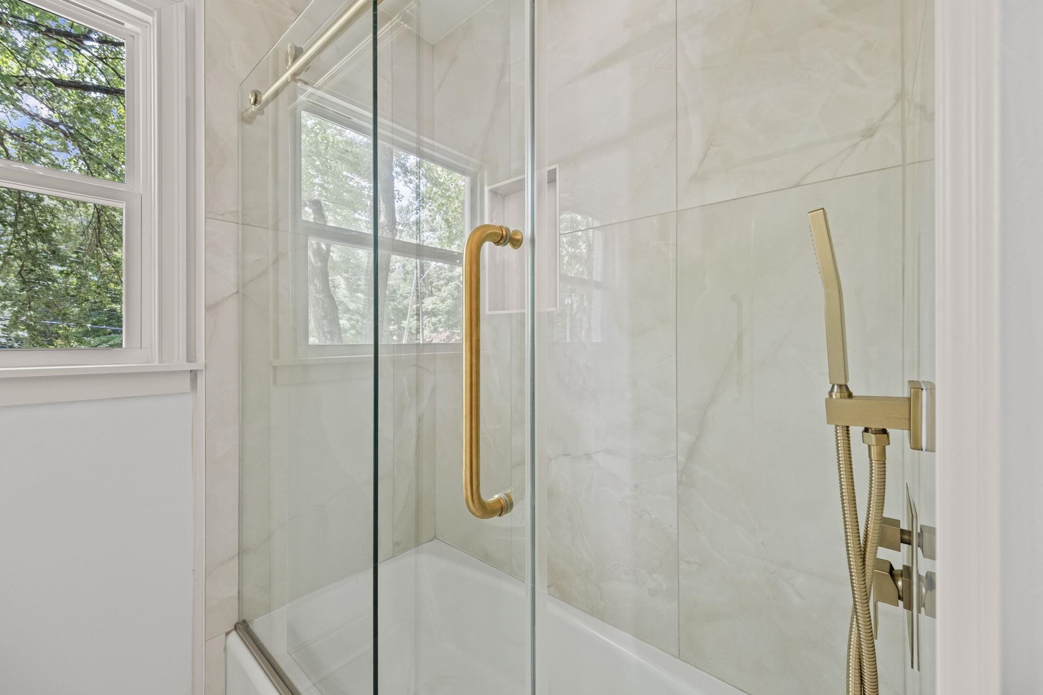 7086 McVay Road Germantown, TN 38138 - Photo 18 of 40 Hall bath with gold fixtures and roller shower door.
