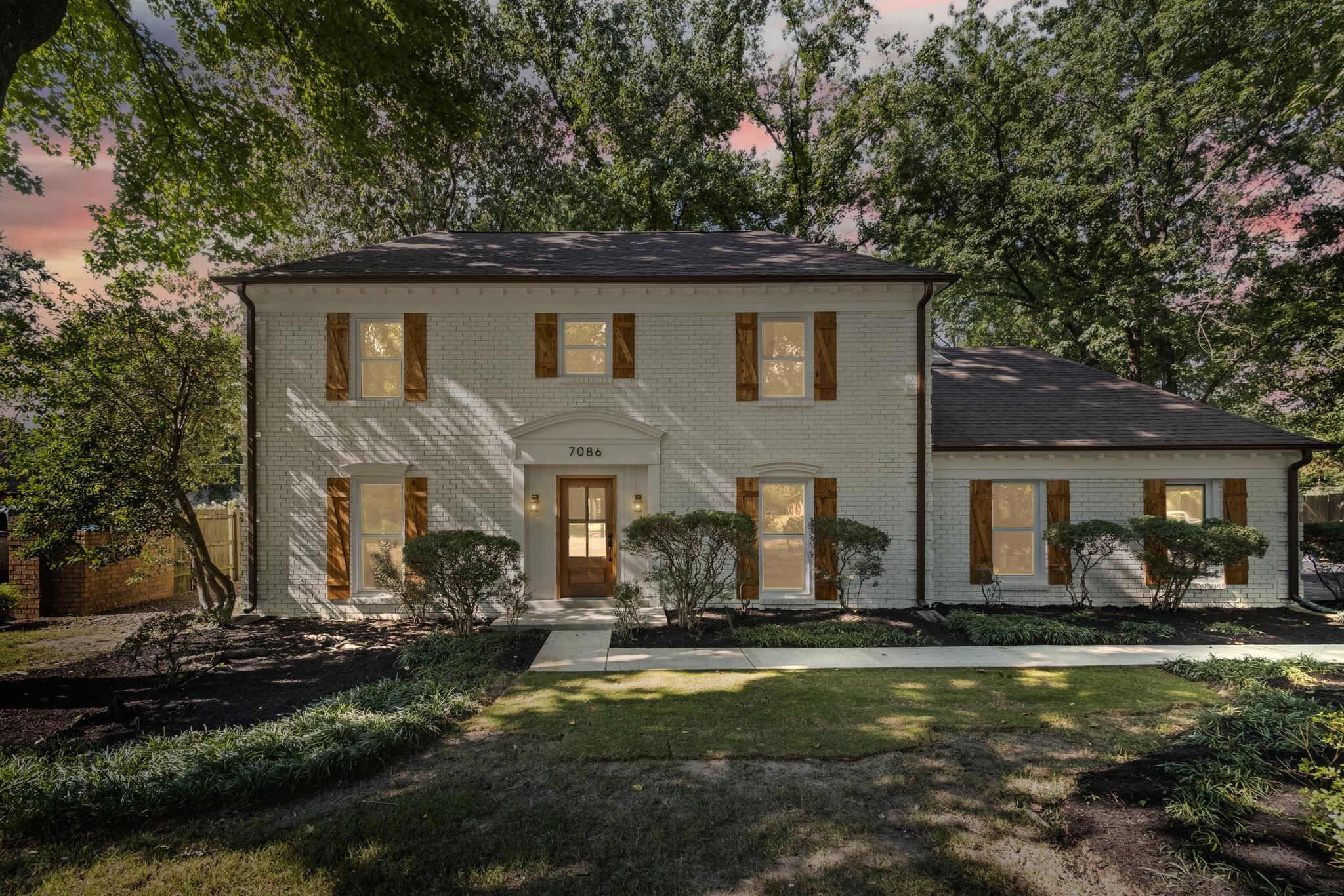 7086 McVay Road Germantown, TN 38138 - Photo 2 of 40 a front view of house with yard outdoor seating and green space