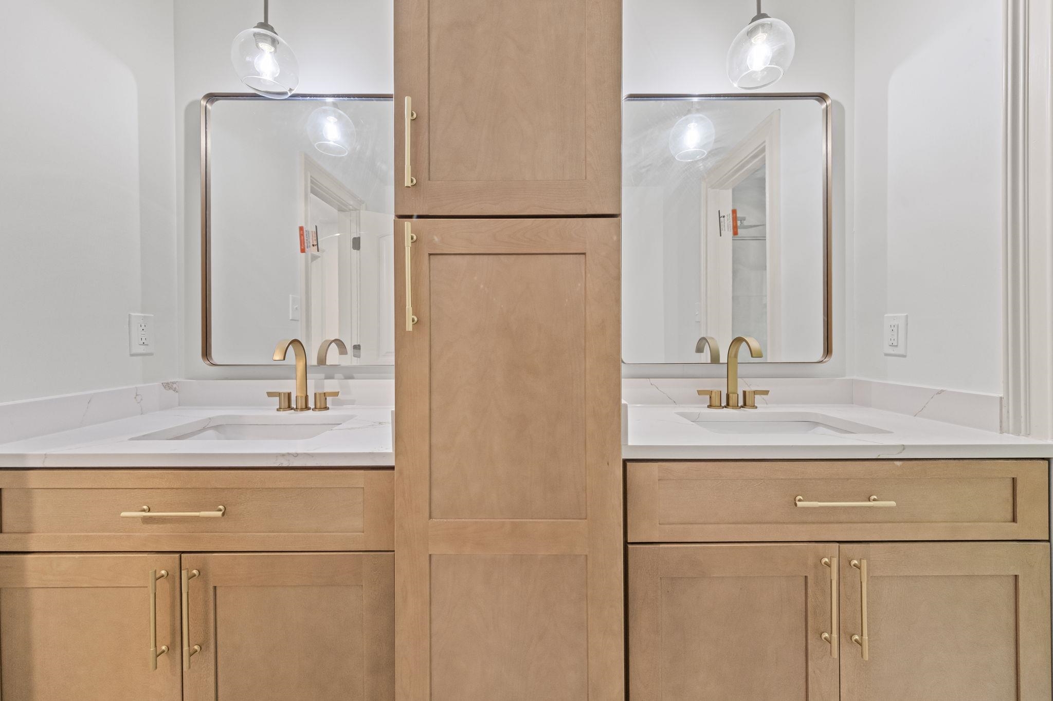 7086 McVay Road Germantown, TN 38138 - Photo 32 of 40 a bathroom with a sink and a mirror