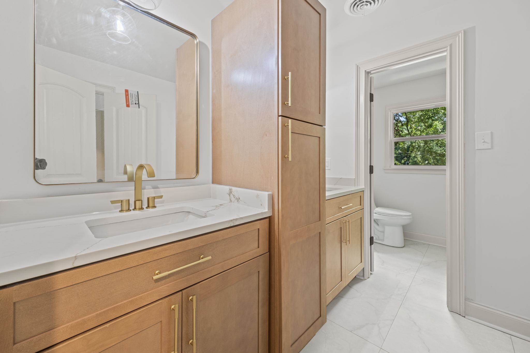 7086 McVay Road Germantown, TN 38138 - Photo 33 of 40 a bathroom with a sink and a toilet