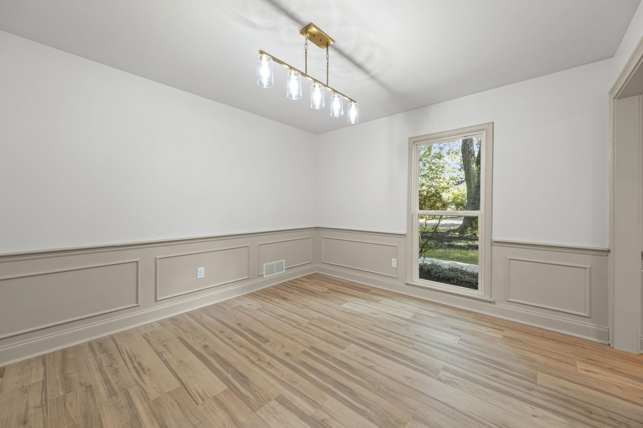 Dining room with custom light fixture