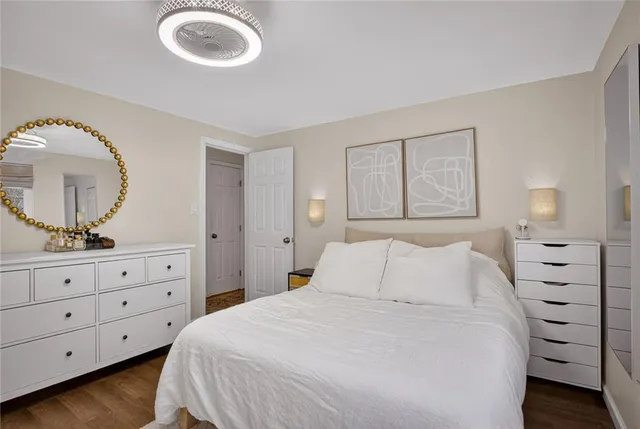 a bedroom with a bed and a dresser