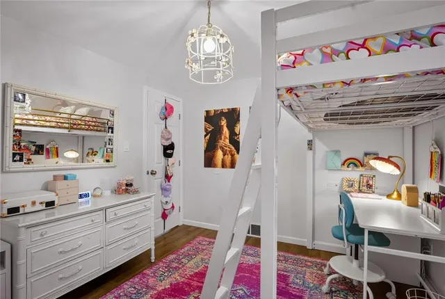 a bed room with a bed and a book shelf