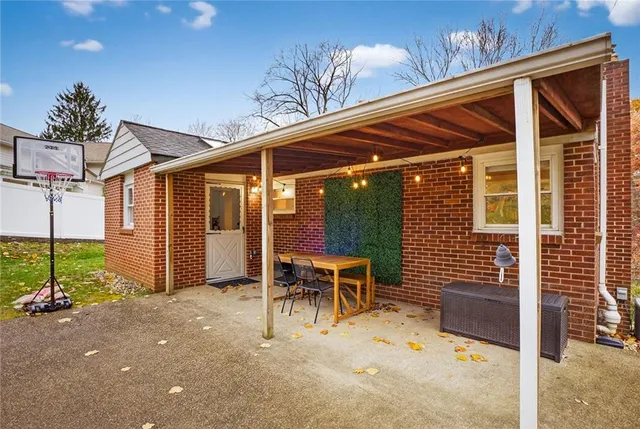 a patio with table and chairs