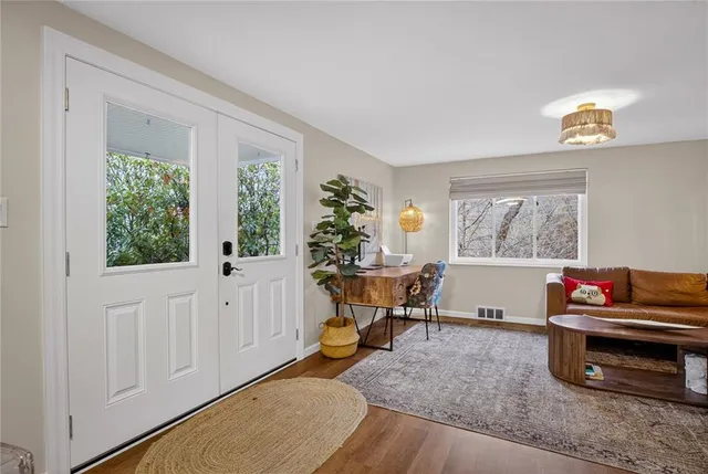 a living room with furniture and a window