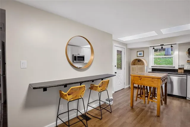 a view of a living room and dining room