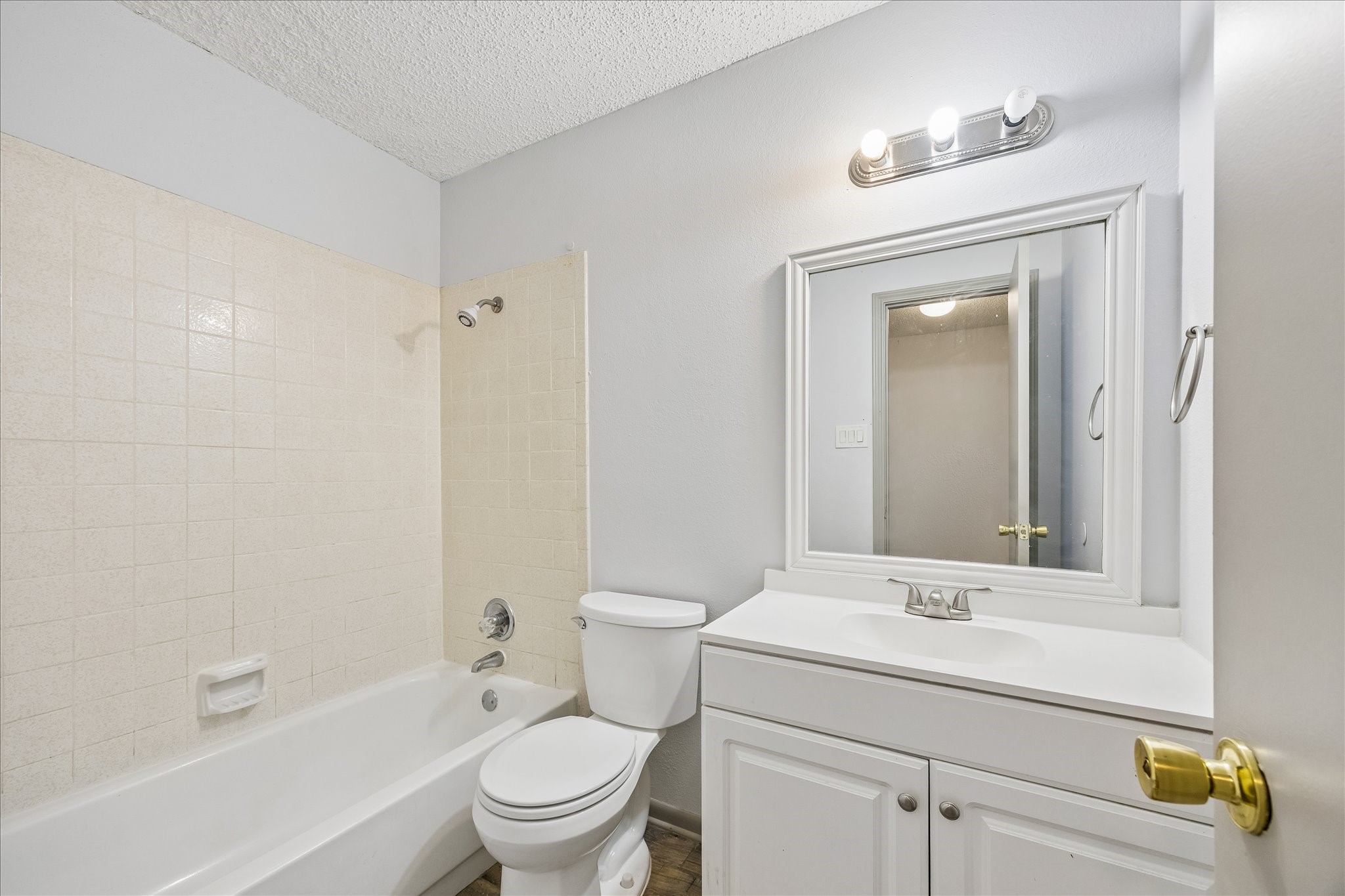 206 Lockett Street Brenham, TX 77833 - Photo 11 of 12 a bathroom with a sink toilet and shower