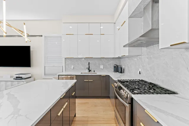 a kitchen with a sink stove and microwave