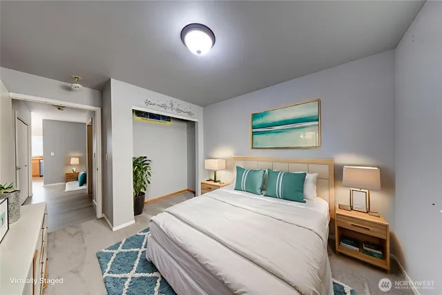 a bedroom with a bed and a large mirror