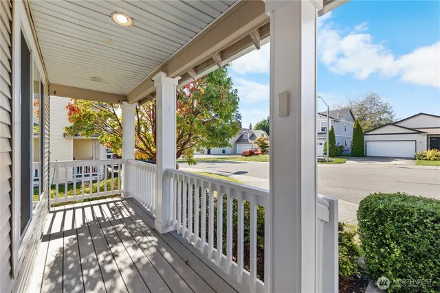 a view of a porch with wooden floor