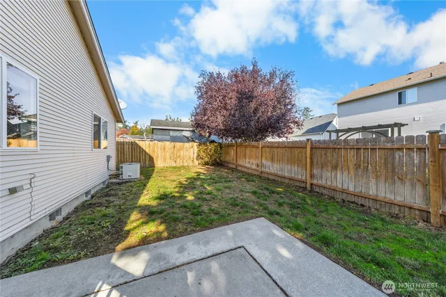 a view of a backyard with sitting area