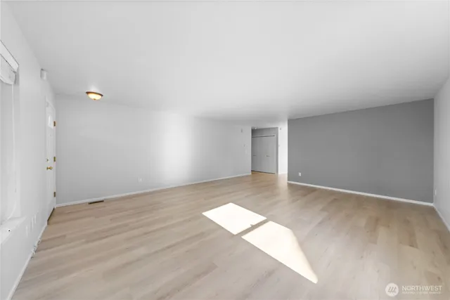 a view of an empty room and window