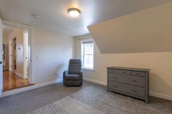a room with furniture and a ceiling fan