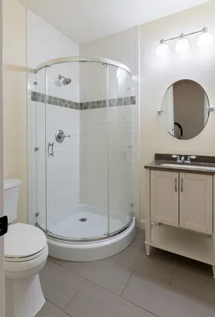 a bathroom with a toilet and a shower