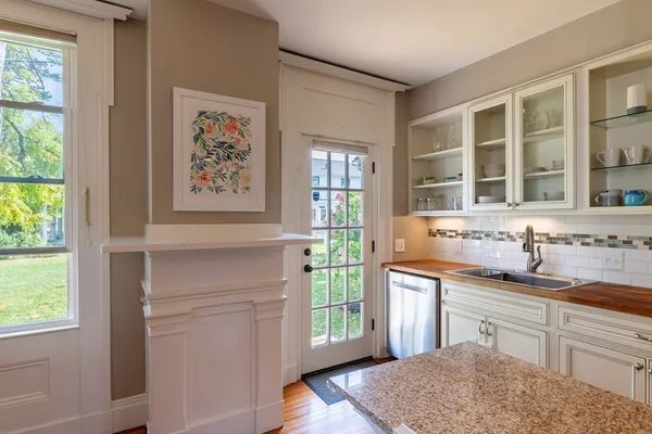a kitchen with a sink cabinets and window