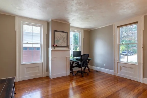 a view of a livingroom with furniture and a window